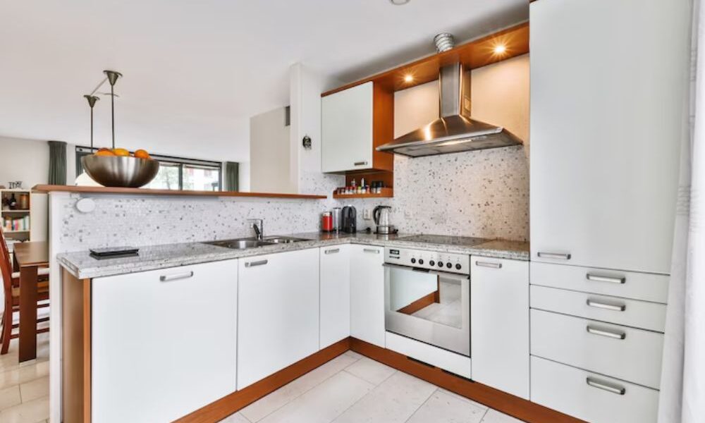 Why is an L-shaped design ideal for small and medium-sized kitchens?