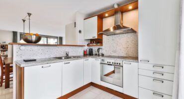 Why is an L-shaped design ideal for small and medium-sized kitchens?